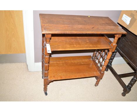 An unusual late 19th Century three-tier oak occasional table or shelf unit with decorative turned supports joined by turned t
