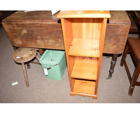 A ropework footstool; a circular stool with three legs; a green enamelled bread bin; and a small pine shelf unit.