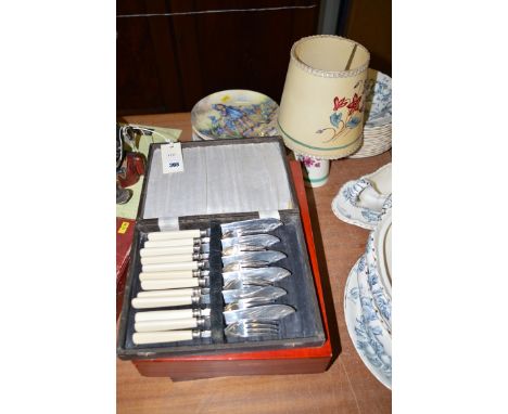 A set of fish knives and forks; two empty wooden boxes; a Flosmaron ware table lamp and matching shade; and seven Collectors'