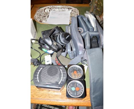 A Pentax camera and accessories; together with a barometer; and a Roberts radio.