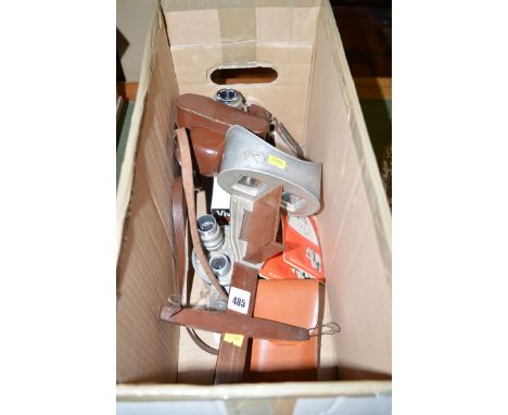 A Voightlander camera; 605 GB Bell & Howell cine camera; and a stereoscope; etc.