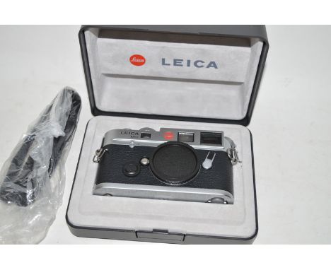 A Leica M6 TTL (0.85) rangefinder camera body, silver chrome finish, in original box, with leather case and strap.