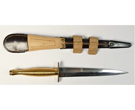 A reproduction Third Pattern Fairburn Sykes fighting knife, with brass ribbed hilt, straight crossguard, signed J. Himsworth 