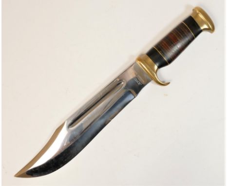 A Down Under The Outback hunting knife, 27cm blade, brass guard and pommel, ebony and leather handle.This bladed product is n