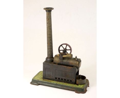 A German made tinplate steam engine, with embossed brickwork on the chimney, brass fittings, painted tin base plate, housing 