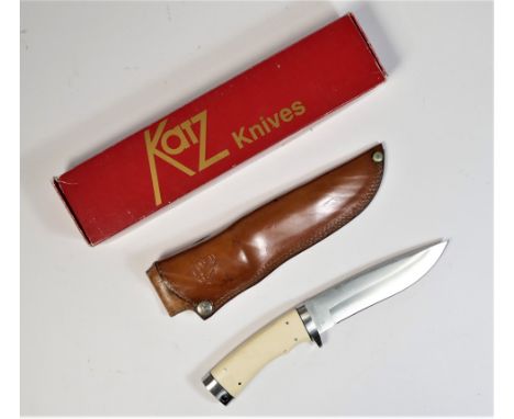 A Katz XT80 Lion King hunting knife, the 15.5cm stainless steel blade made in Japan, ivorine handle, leather scabbard stamped