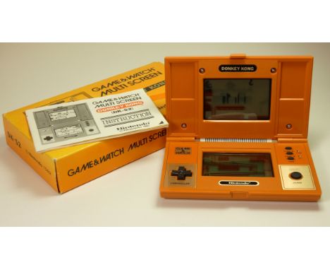 A Nintendo Game and Watch (Donkey Kong) multiscreen handheld game c.1982 (serial number 42761563) In original box with manual