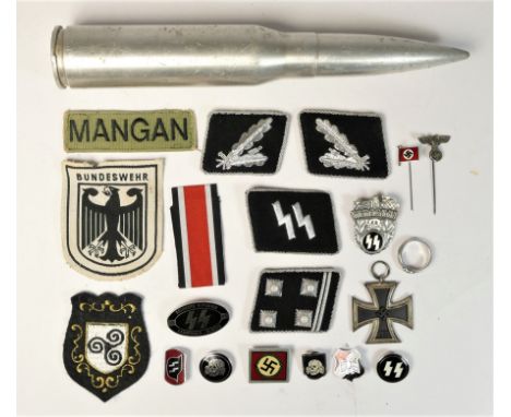A collection of SS badges, to include Wewelsburg, Kampfbahn Olmutz, silver wire Officers pips, a ring an Iron Cross and other
