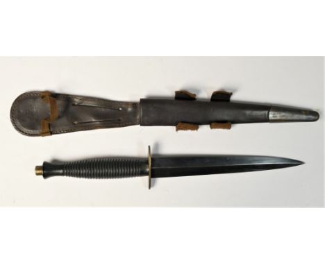 A WWII Third Pattern Fairburn Sykes fighting knife, with ribbed hilt, straight crossguard, blued tapered 17.5cm blade in orig