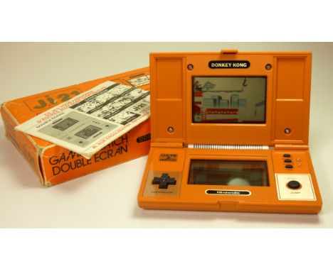 A Nintendo Game and Watch (Donkey Kong) multiscreen handheld game c.1982 (serial number 33852367) In original box with manual