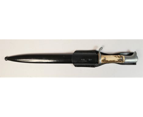 A German Third Reich style Mauser horn handle dagger, inscribed to blade SS Karl Baier - Kriegsjahr 1941 SS and E. Pack A Son