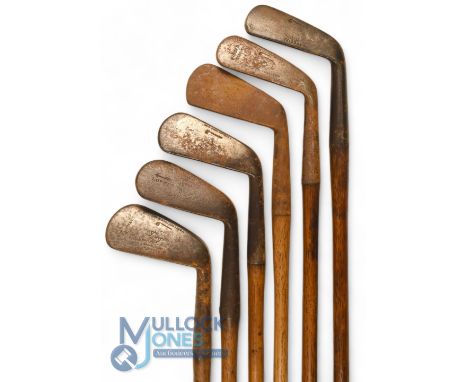 6x Assorted irons features 4x Tom Stewart irons 2x jiggers, lofting iron and mashie, t/w another lofting iron showing the And