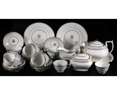 An early 19thC part tea service, to include a teapot and cover, sucrier and cover, creamer, teapot stand, saucer dishes, cups