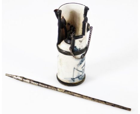 A Chinese Qing period blue and white porcelain opium pipe, with metal additions, the cylindrical body with chain and removabl