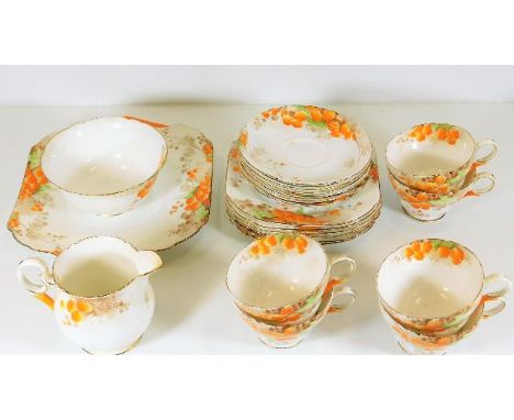 Twenty one pieces of Shelley mimosa 50238 china tea service