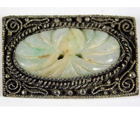 A 20thC. Chinese silver brooch with carved jade decor