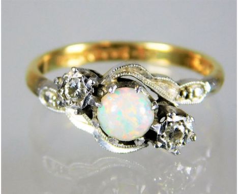 An 18ct gold art deco ring set with opal & diamond within a platinum mount 3.3g size L