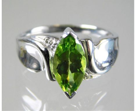 An 18ct white gold ring set with marquise cut peridot 4.5g size N/M