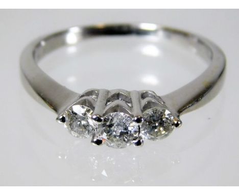 A 14ct gold ring set with three diamonds of approx. 0.5ct 3.1g size P