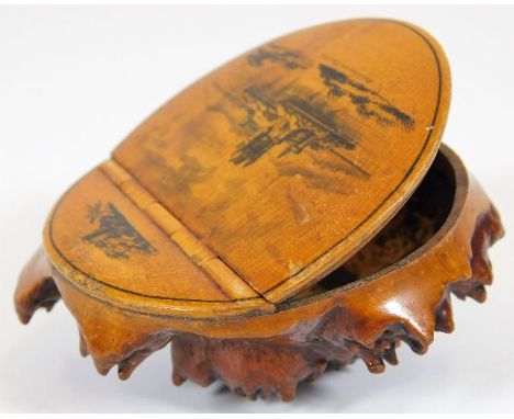A 19thC. mauchline ware naturalistic snuff box with hinged lid featuring Lochleven Castle