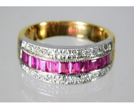 An 18ct gold ring set with 0.5ct diamond with a ruby band 8.4g size N