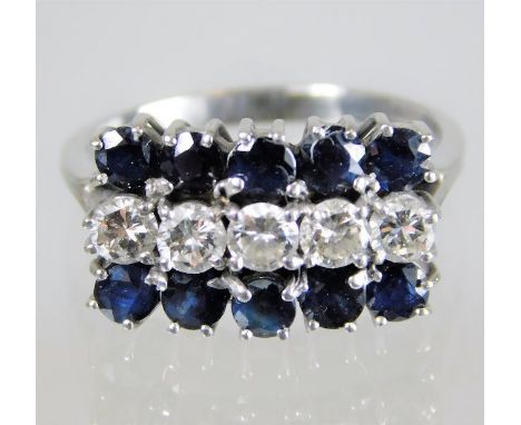 An 18ct gold sapphire & diamond ring with approx. 0.75ct diamonds 5.7g size O/P 