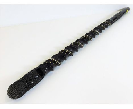 An African hardwood cane with barley twist style decor inlaid with bone, some losses 32.5in long