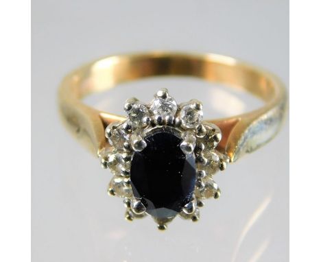 An 9ct gold diamond & sapphire ring 3.6g size L/M