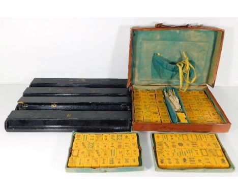 A Chinese c.1900 leather cased mahjong set with stands, one a/f