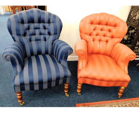 Two small modern upholstered button back low level armchairs