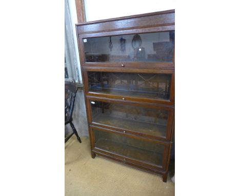 A Globe Wernicke style stacking sectional oak bookcase. 4 tiers. Made by Gunn and Co. Very good condition - 86cm x 25cm x 146