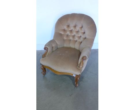 A Victorian button back walnut armchair on shaped legs and scroll arms - Height 83cm x Width 68cm