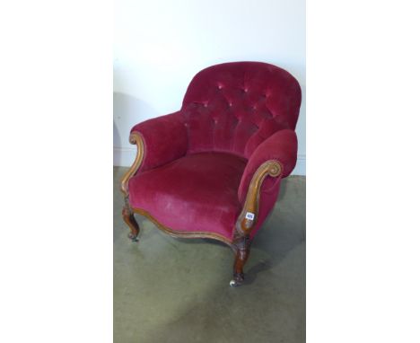 A Victorian button back walnut armchair on shaped legs and scroll arms - Height 77cm x Width 80cm 