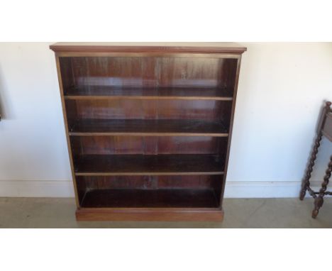 A mahogany adjustable four shelf bookcase - 105cm x 29cm x 119cm high