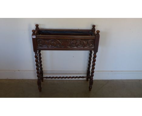 A carved oak planter with barley twist legs - 70cm x 25cm x 84cm