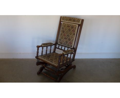 An American tapestry covered rocking chair
