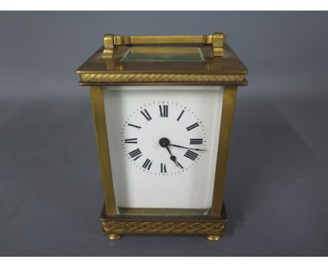 A brass carriage clock - not working - Height 12cm - chip to front glass