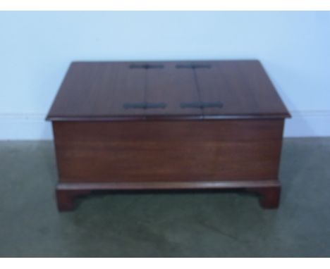 A mahogany trunk with two hinged lids raised on bracket supports - 90cm x 60cm x 45cm