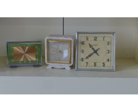 An onyx mantle clock by Elliot and two chrome mantle clocks one retailed by Mathers and Son, Cambridge