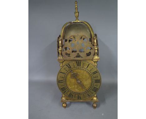 A 20th century brass lantern clock of typical form - Height 30cm