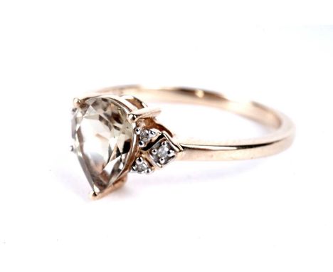 A csarite and diamond ring, the pear-shaped csarite weighing approximately 1.17 carats, in 9ct yellow gold, size N 1/2, 2.2g 