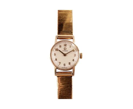 An Omega 9ct gold cased manual wind cocktail watch, the silvered dial, with gilt Arabic hour markers, on Portuguese gold brac