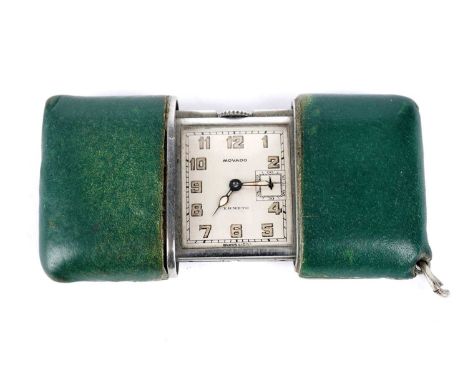 An Art Deco Swiss Movado Ermeto pocket watch or travel clock, the Arabic dial with subsidiary seconds at 3, in sliding green 