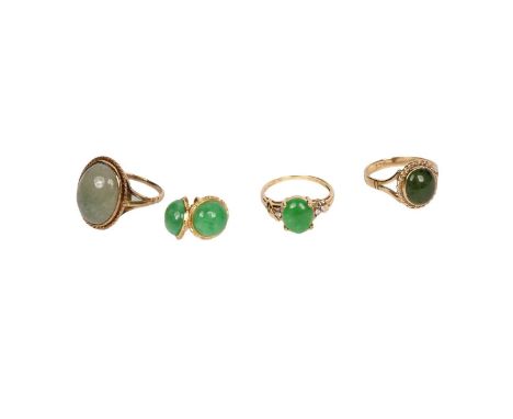 A selection of jade simulant jewellery, comprising: three rings and a pair of earrings, in gold mounts, 11.8g gross.