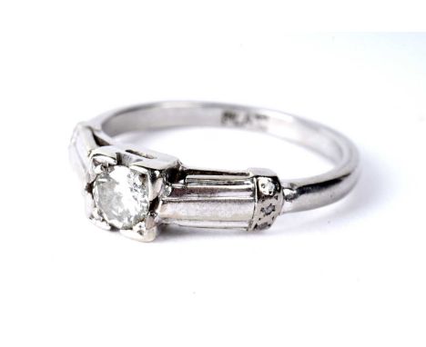 A solitaire diamond ring, the illusion set round brilliant-cut diamond weighing approximately 0.23 carats, in white metal, st