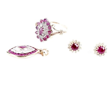 A suite of ruby and diamond cluster jewellery, comprising: a ring, a pendant and earrings, in gold mounts.