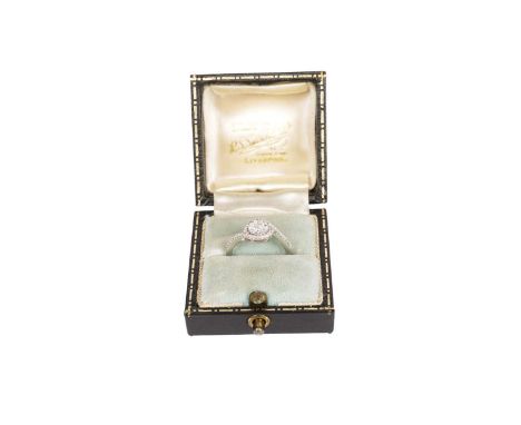A diamond cluster ring, the cluster within cross-over mount, 9ct yellow gold setting and shank, ring size M, 2.3g gross.