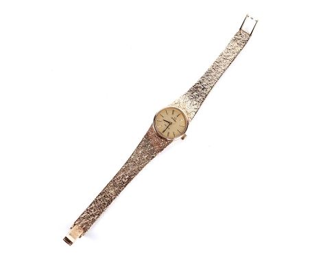 An Omega De Ville 9ct gold cased lady's manual wind cocktail watch, on a 9ct gold bracelet strap with Omega clasp, 30.9g gros