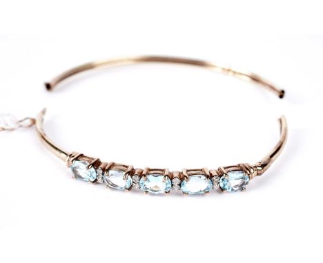 A topaz and diamond bangle, in 9ct yellow gold, 65mm wide, 6.9g gross. (Broken in two)