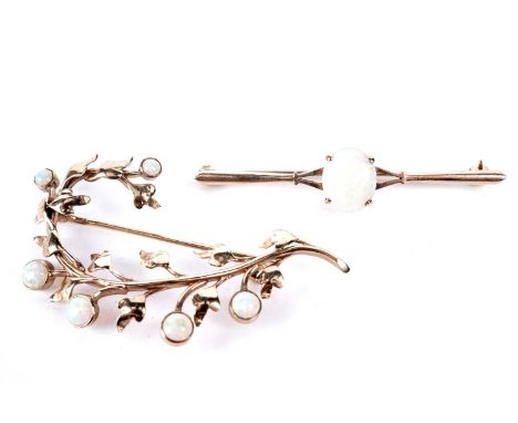 Two opal brooches, one in floral setting, 6.0cms wide; the other bar, 5.6cms wide, both in gold mounts, 10.7g gross.